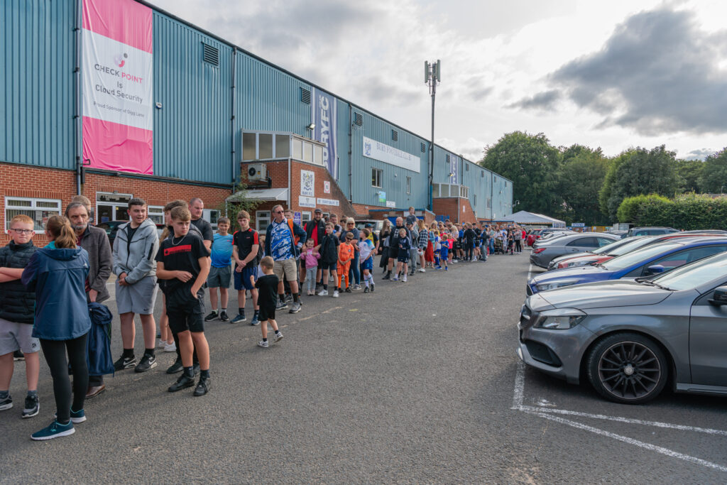 Crowds queuing outside the front of Gigg Lane for the Open Training Session, taken by Phil Hill 